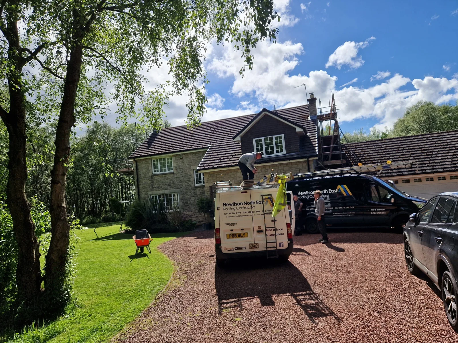 Completed pitched tiled roof on a stone house by Hewitson Roofing in the North East